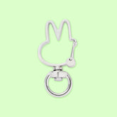 A silver-colored metal key ring shaped like a rabbit.
